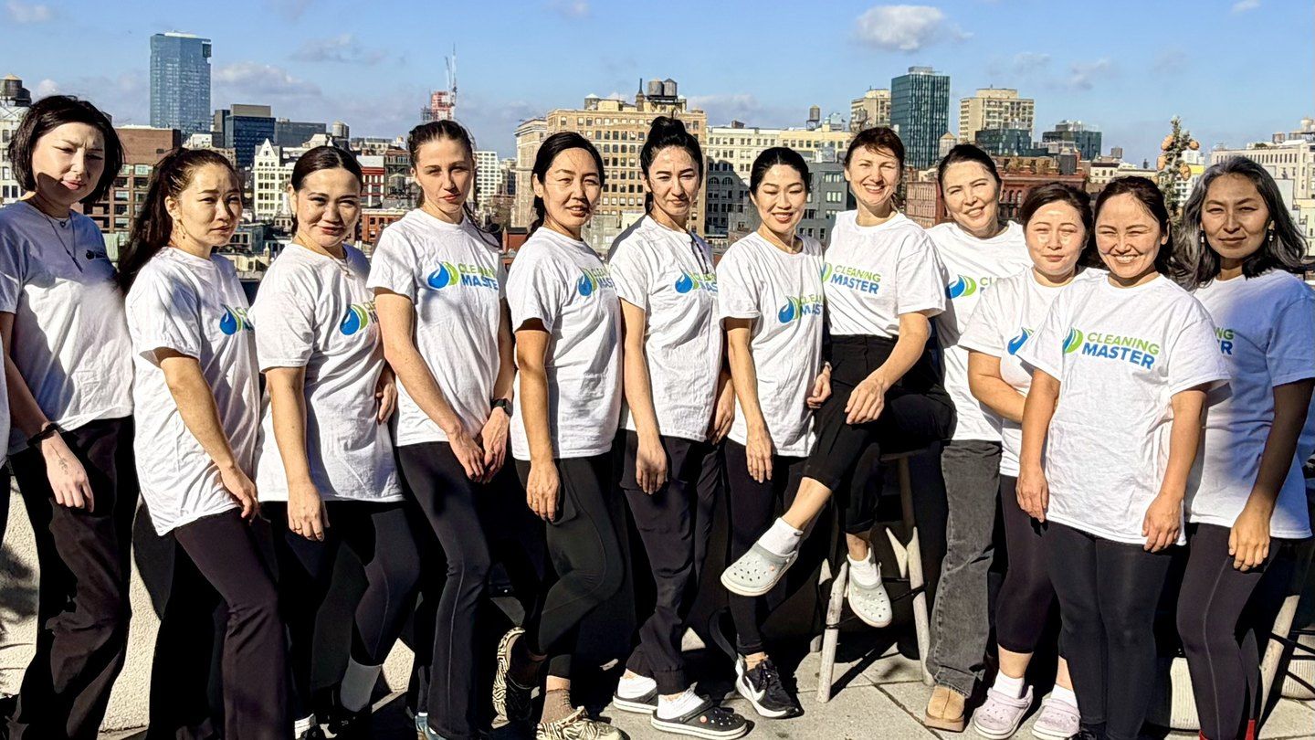 The Cleaning Master team of professional cleaners on a sunny rooftop in New York