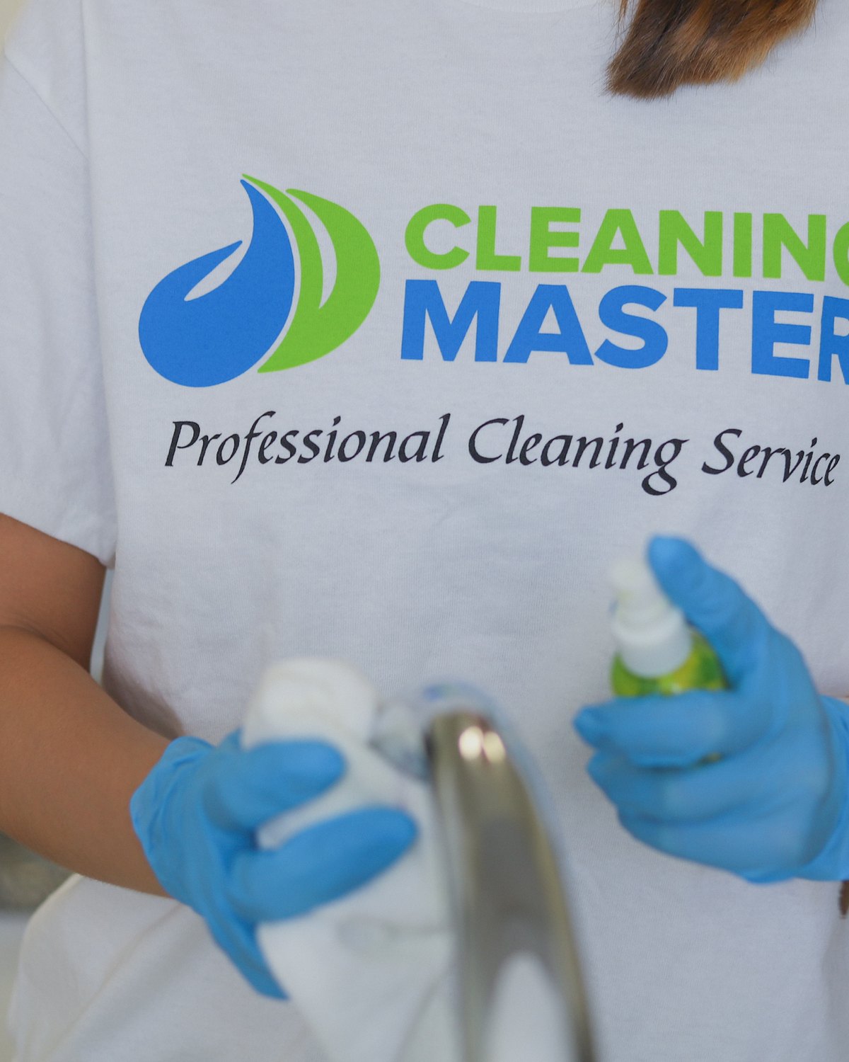 Gloved Cleaning Master professional wiping a kitchen faucet
